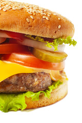 Hamburger classic burger american cheeseburger isolated on white background. Close-up with selective focus.