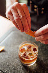 fruit cocktail is prepared by a bartender