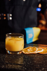 fruit cocktail is prepared by a bartender