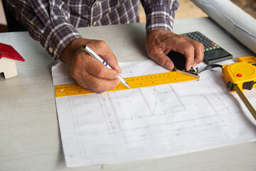 Engineer and Architect structural design blueprint  at Construction Site