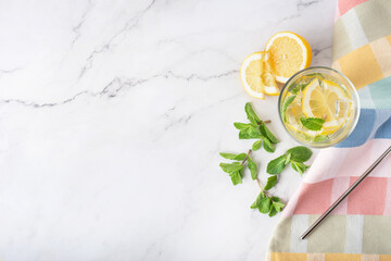 lemonade with mint and lemon on white marble table - obrazy, fototapety, plakaty