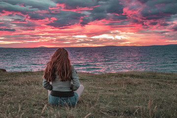 Woman watching the sunset.