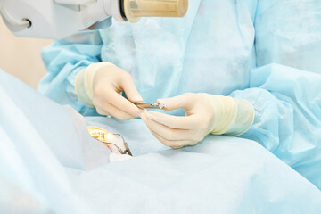 Ophthalmology laser microscope operation. Doctor surgery in clinic. Patient eye treatment. Myopia...