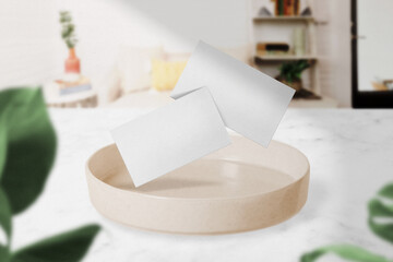 Clean minimal business card mockup floating on plate in the room