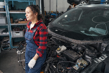 Thoughtful mechanic having time for break during workday