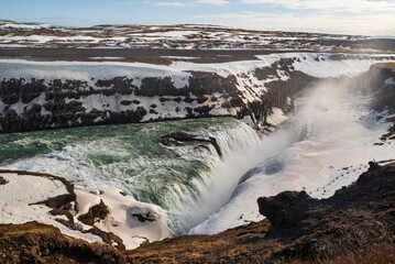 Winter scenery at Gullfoss waterfall, showing the waters of river Hvítá plunging down its lower stage into a crevice, Golden Circle Route, Iceland