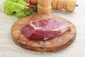Raw rib-eye beef steak black angus