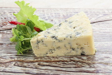 Blue cheese piece over board