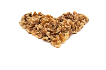 A handful of walnuts in the shape of a heart. Isolated on white background. Nuts are available in...