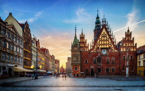 Wroclaw central market square with old houses and sunset. Panoramic evening view, long exposure, timelapse.  Historical capital of Silesia, Wroclaw (Breslau) , Poland, Europe.