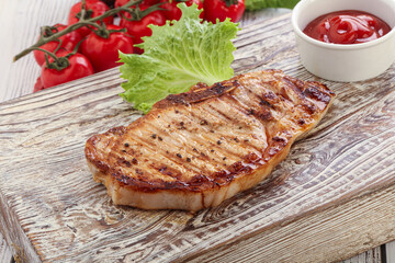 Grilled pork steak with ketchup