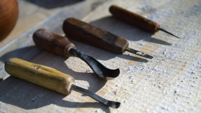 Close-up view of ancient wood carving tools. Slavic Northern culture