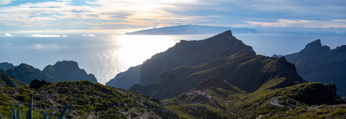 Mountains range in Rural de Teno park near isolated village Masca on Tenerife and La Gomera island on background, Canary islands, Spain