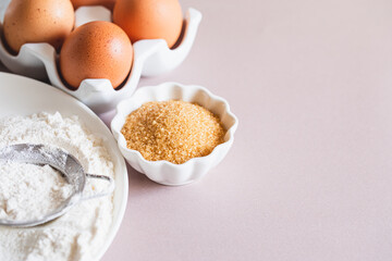 Baking or cooking background frame. Ingredients, kitchen items for baking cakes. Kitchen utensils, flour, eggs, brown sugar, butter. Text space, top view. Cookies Pie Or Cake Recipe Mockup