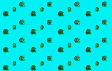 Creative pattern of cauliflower. Ingredients for proper nutrition on green background. The concept of healthy diet. Design for wrapping paper