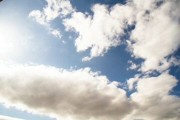 Cumulus clouds. White clouds on a blue background.