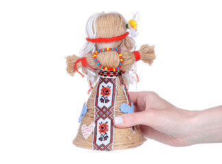 Ukrainian national doll in hand on white background isolation