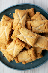 Homemade Organic Apple Pie Cookies on a Plate on a white wooden surface, top view. Flat lay, overhead, from above.