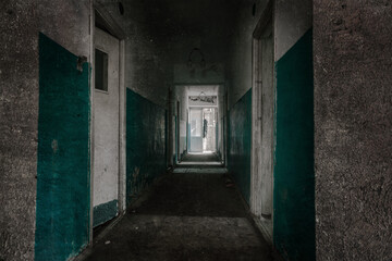 Fototapeta na wymiar An old abandoned corridor in a pioneer camp. Light from doorways. Shabby walls. Forgotten place.