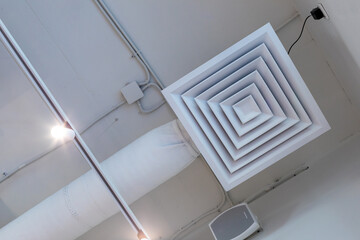 Pipe of supply and exhaust ventilation system on ceiling of coffee shop, commercial room or...