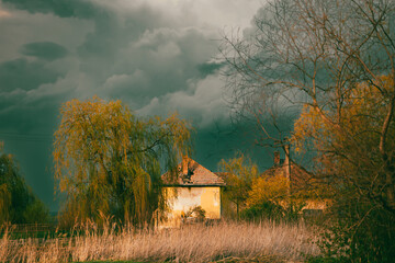 Old creepy haunted house on a stormy day