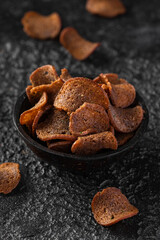 Garlic dark bread crisps, finger party food, beer snack
