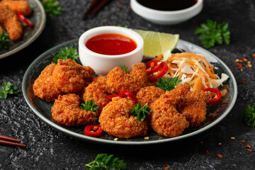 Crispy Prawns in breadcrumbs. Served with cabbage, carrot salad and soy and sweet chilli sauce