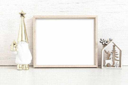 Wooden frame mockup with christmas attributes.