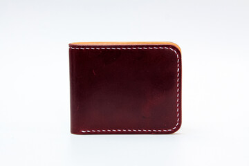 Red or Maroon natural leather wallet isolated on a white background. Closeup expensive wallet....