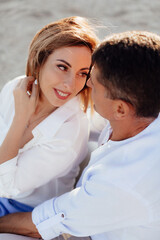Obraz premium Happy romantic middle aged couple are by the sea. Closeup photo.