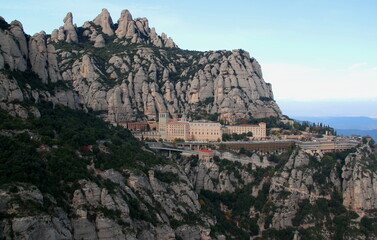 Fototapeta na wymiar View of the monastery of Montserrat, the surrounding mountains and the skyline near Barcelona, Catalonia, Spain