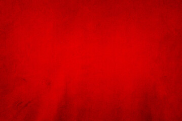 Red matte background of suede. Velvet texture of seamless leather. Red suede texture.