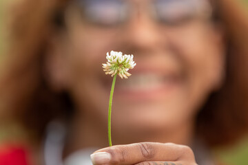 closeup of plant or herb in girl's hand