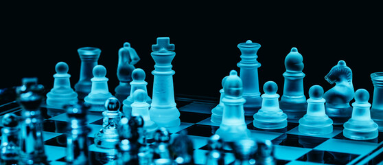 Glass chess, on the black background. Stock images. Close-up view