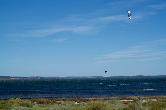 Flying kytesurfer in the air