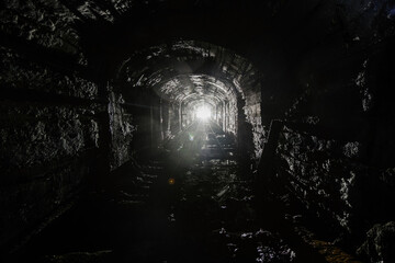 Dark abandoned mine in backlight