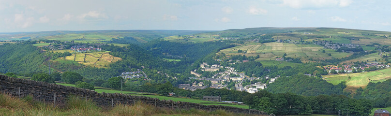 Fototapeta na wymiar wide panoramic view of the calder valley showing hebden bridge, heptonstall and old town surrounded by west yorkshire countryside