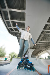 Vertical full length portrait of teen girl doing rollerblading tricks in skatepark outdoors