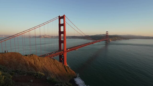 San Francisco Golden Gate Bridge at sunset with moving traffic. California, USA