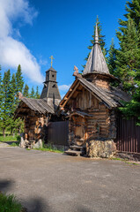 Fototapeta na wymiar Ural Mountains, Zyuratkul National Park. A house for tourists and a Christian chapel on a tourist base.