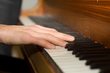 Fototapeta na wymiar playing hands on Piano Keyboard hands on