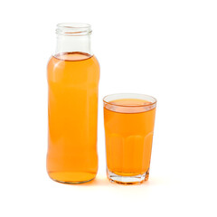 Glass bottle and glass with orange drink.Orange, pumpkin, grape or apricot juice.Isolated on a white background
