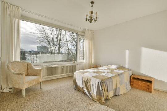 Bedroom interior with bed and windows