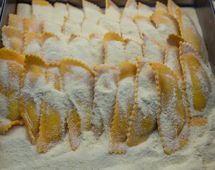 Italian food, handmade mezzaluna pasta ravioli stuffed with four cheeses