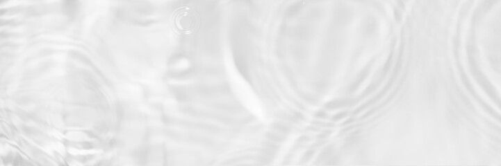 Fototapeta premium Water texture with sun reflections on the water overlay effect for photo or mockup. Organic light gray drop shadow caustic effect with wave refraction of light. Long banner with copy space