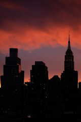 Fototapeta na wymiar Skyline silhouette at dusk in New York City.