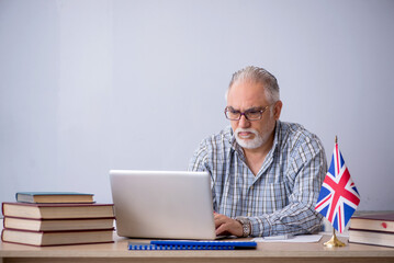 Old english language teacher in the classroom