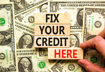 Fix your credit here symbol. Concept words Fix your credit here on wooden blocks on a beautiful...