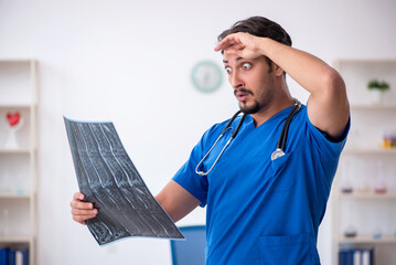 Young male doctor radiologist working in the clinic