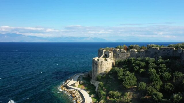 A road at the foot of Koroni Castle facing the Mediterranean Sea in Europe, Greece, Peloponnese, Mani, in summer, on a sunny day.